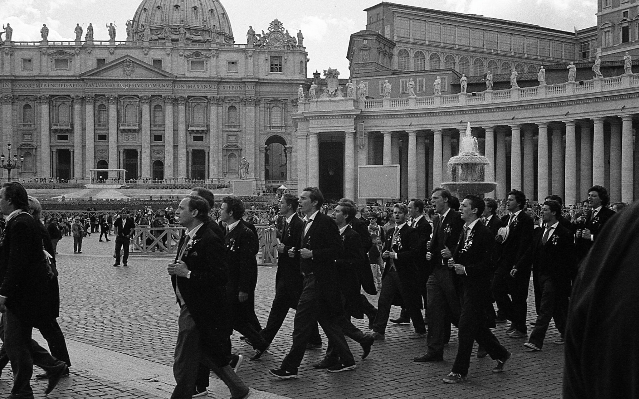 Men singing outside of Saint Peter's Basilica